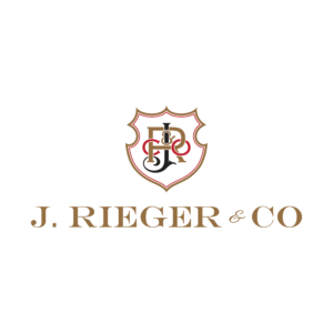 Shield logo with ornate initials and text “J. Rieger & Co.”